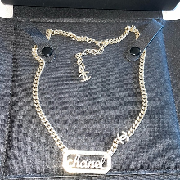 CHANEL Jewelry - CHANEL excellent condition preloved metal  crystal pearl logo necklace gold.